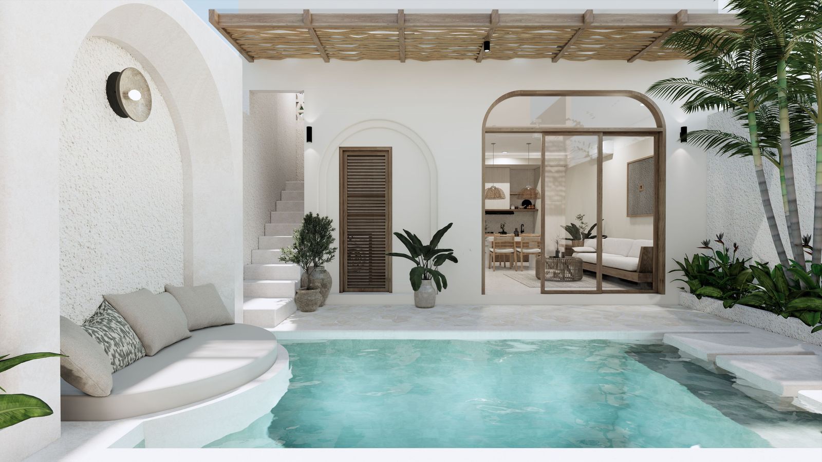 A private pool beside a white villa with arched windows, a thatched roof and an open sitting area in Bali.